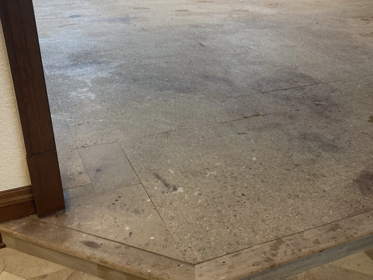 Bare concrete subfloor exposed after old flooring removal in a Milwaukee home