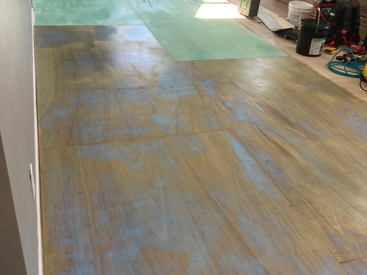 Moisture barrier applied over a subfloor before installation